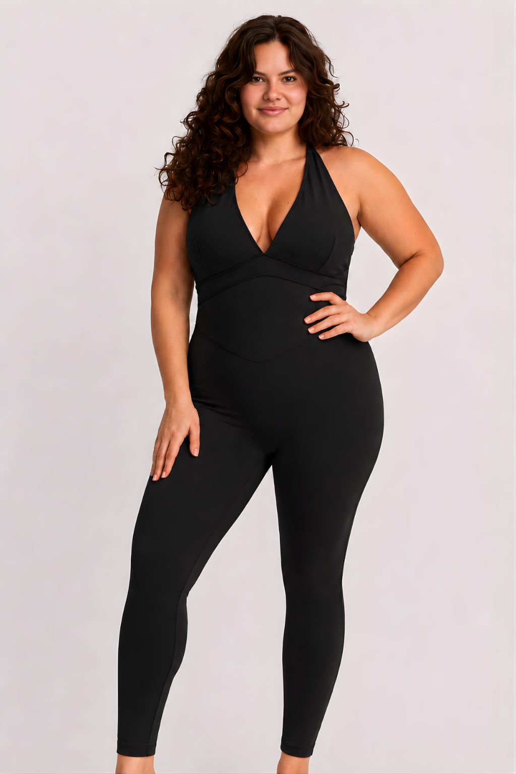 Woman wearing black DropTrou women's jumpsuit - large front studio view #Size_L