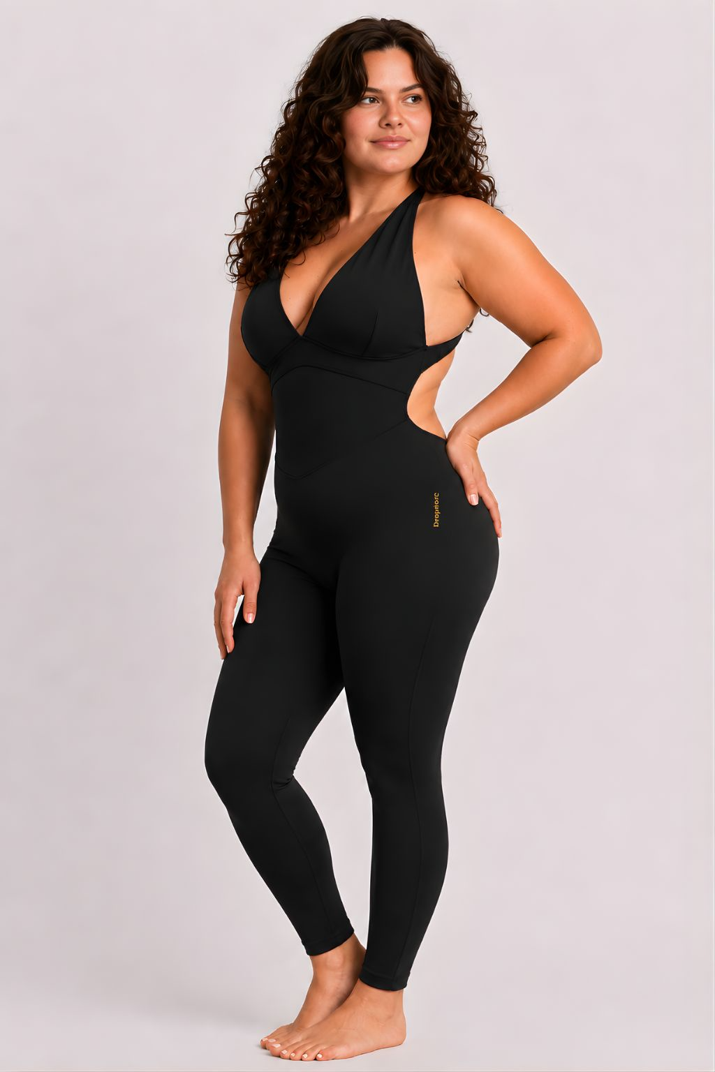 Woman wearing black DropTrou women's jumpsuit - large side studio view #Size_L