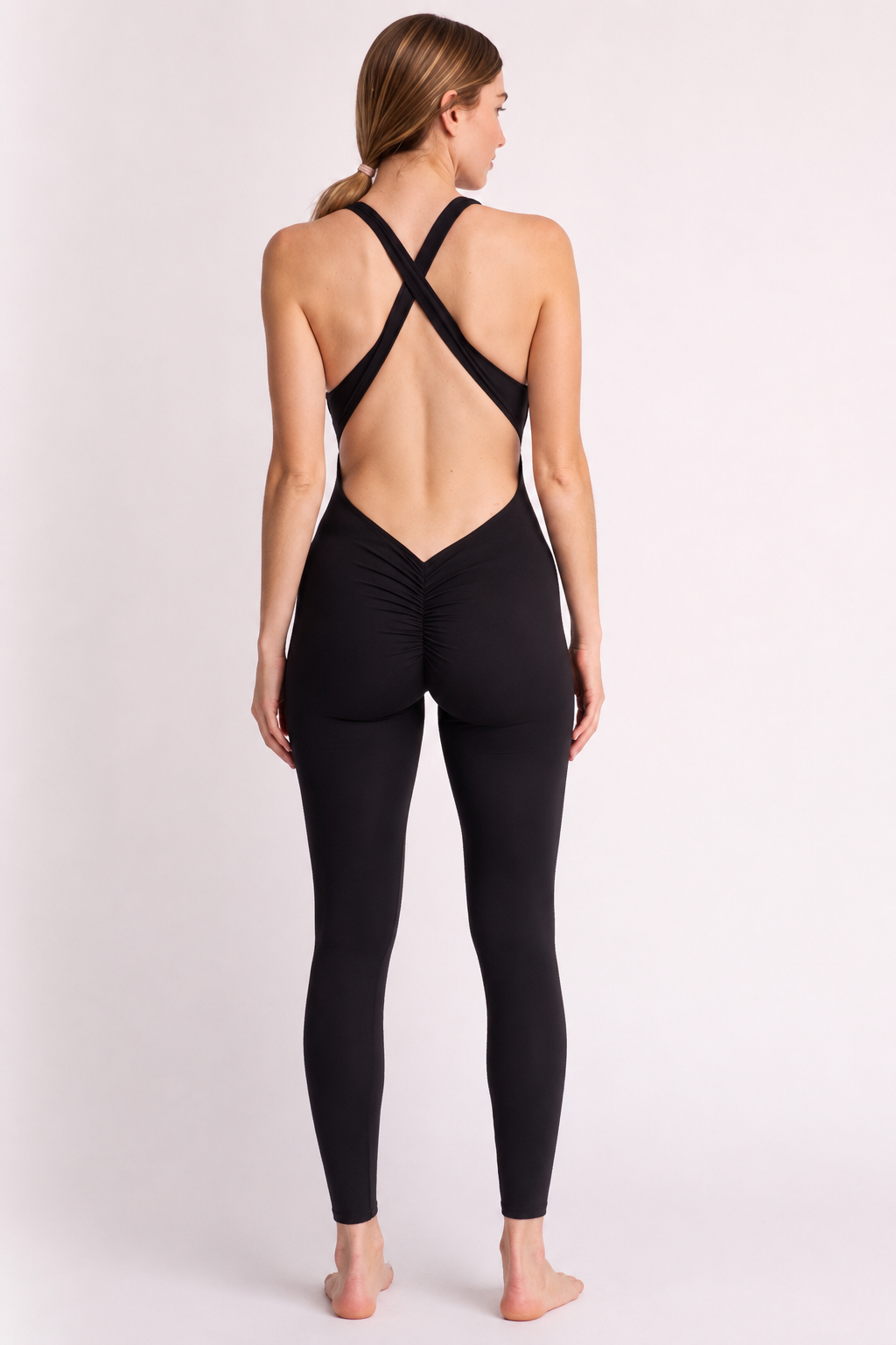 Woman wearing black DropTrou women's jumpsuit back view #Size_S
