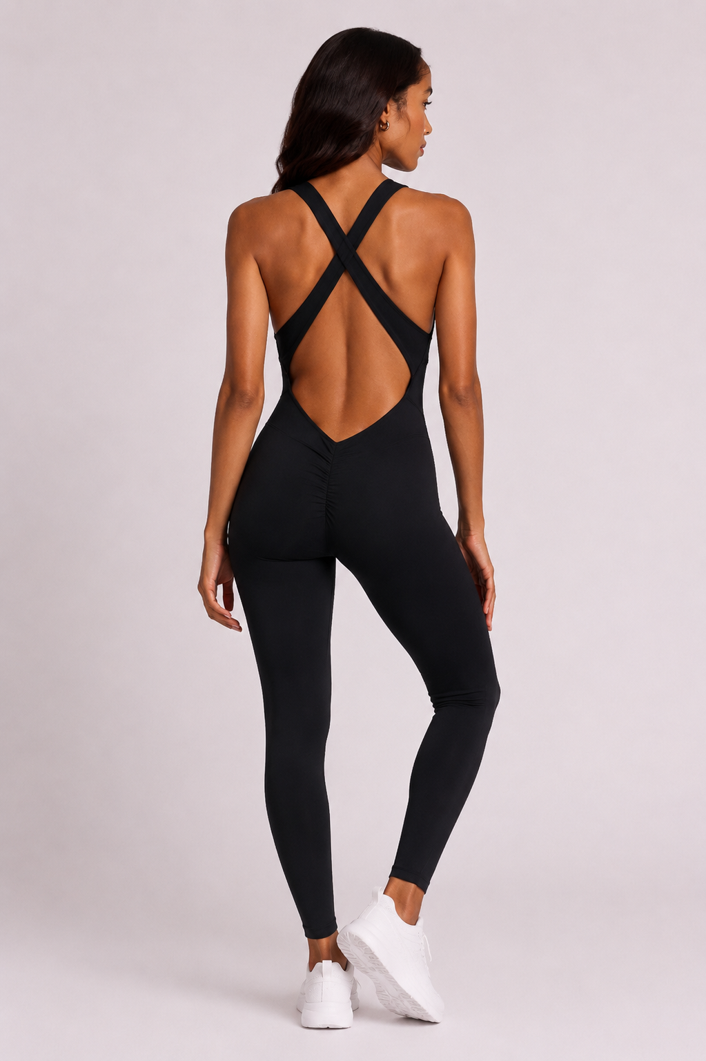Woman wearing black DropTrou women's jumpsuit - extra small back studio view #Size_XS