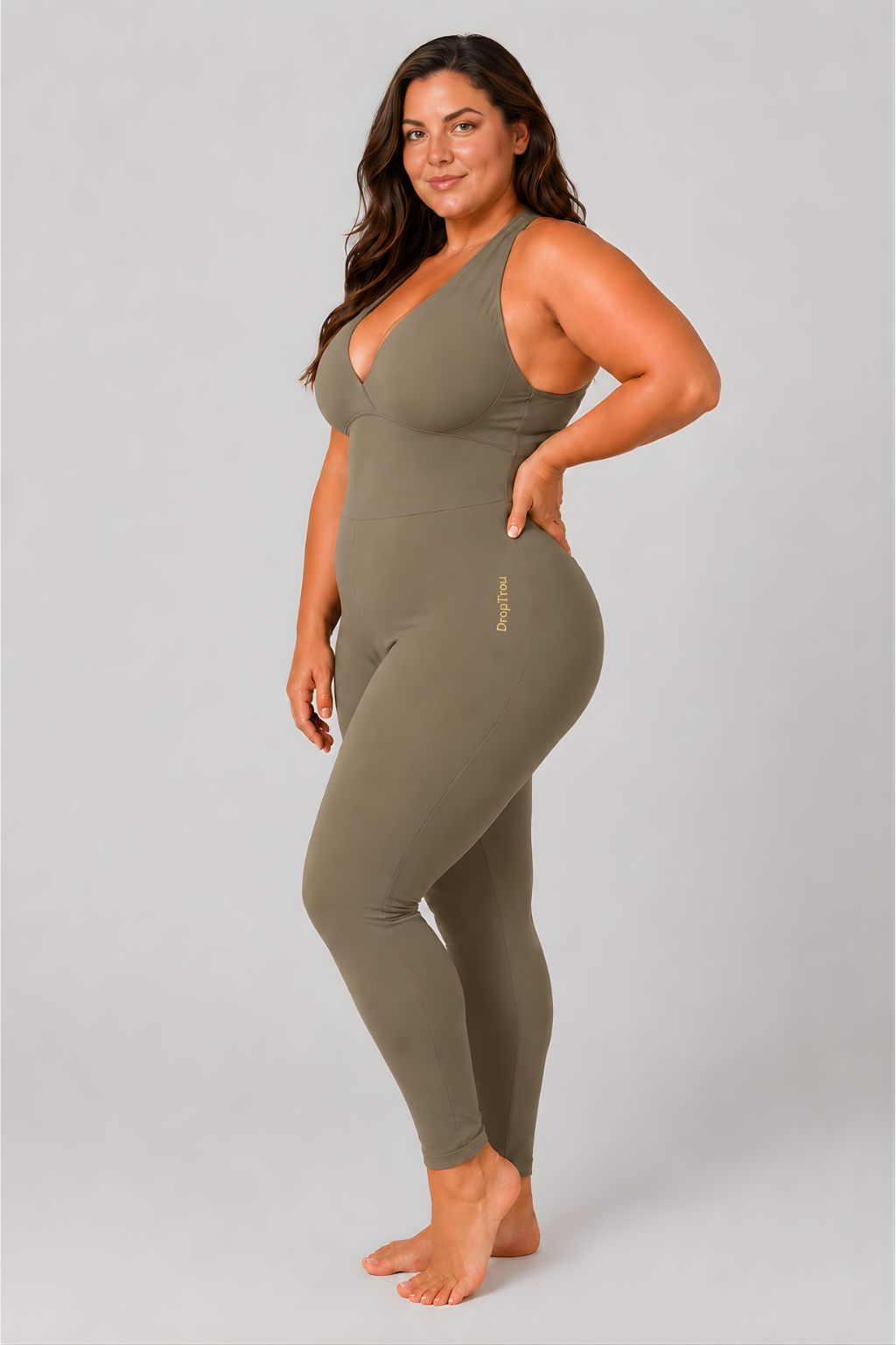 Woman wearing olive DropTrou women's jumpsuit - extra large side studio view #Size_XL