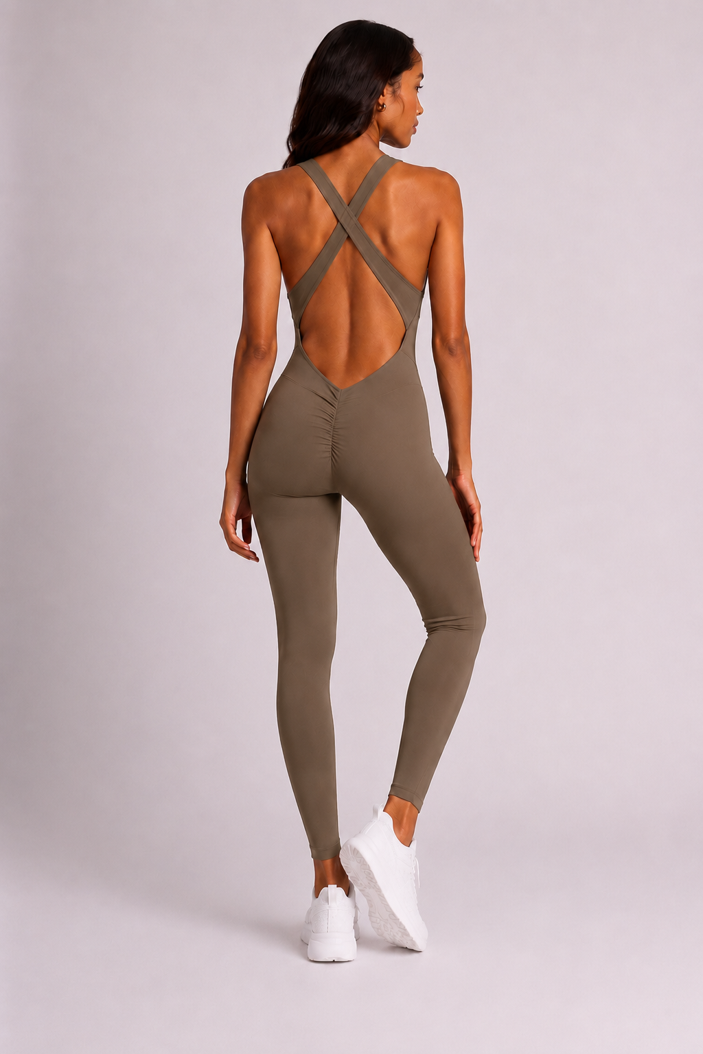 Woman wearing olive DropTrou women's jumpsuit - extra small back studio view #Size_XS