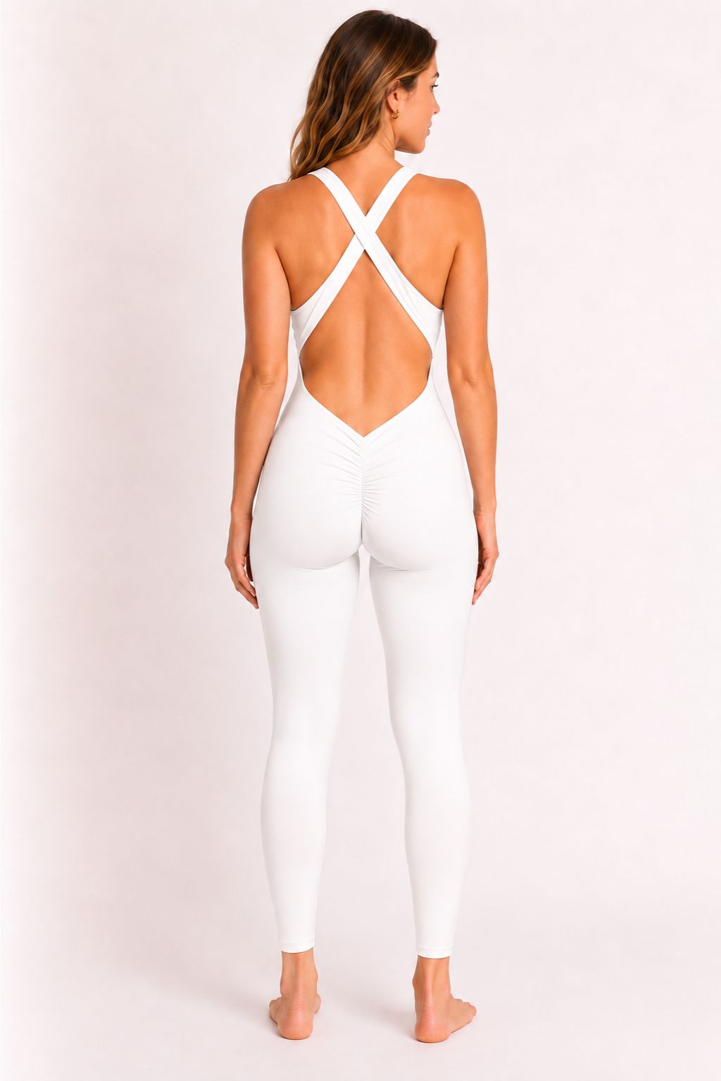 Woman wearing white DropTrou women's jumpsuit - medium back studio view #Size_M