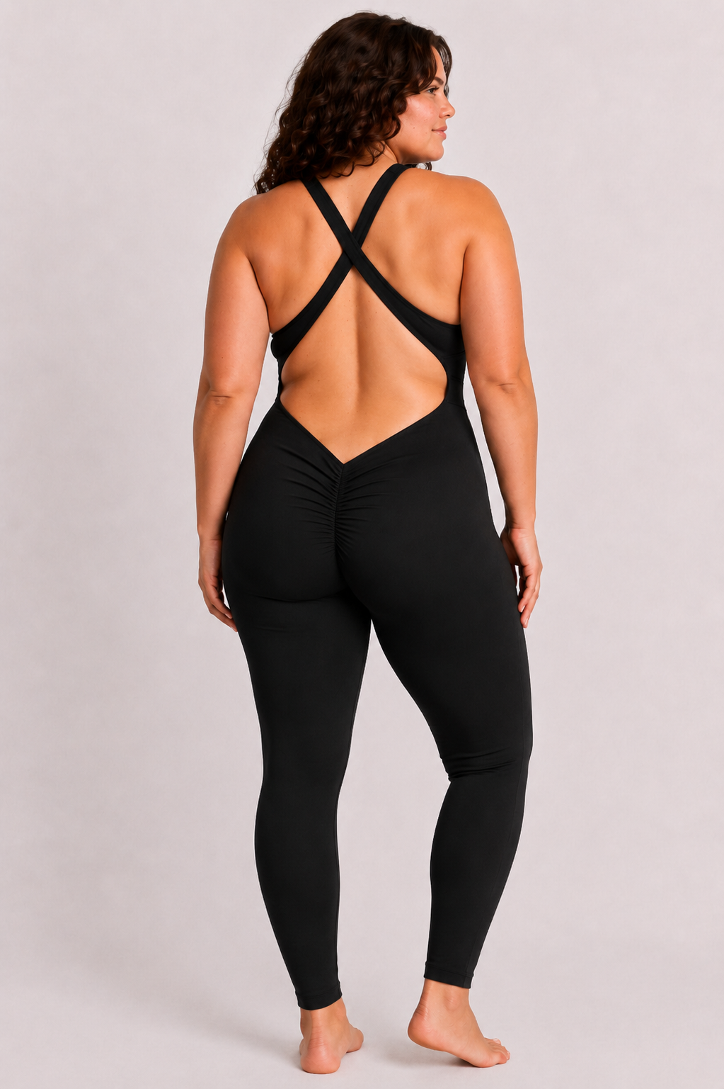 Woman wearing black DropTrou women's jumpsuit - large back studio view #Size_L