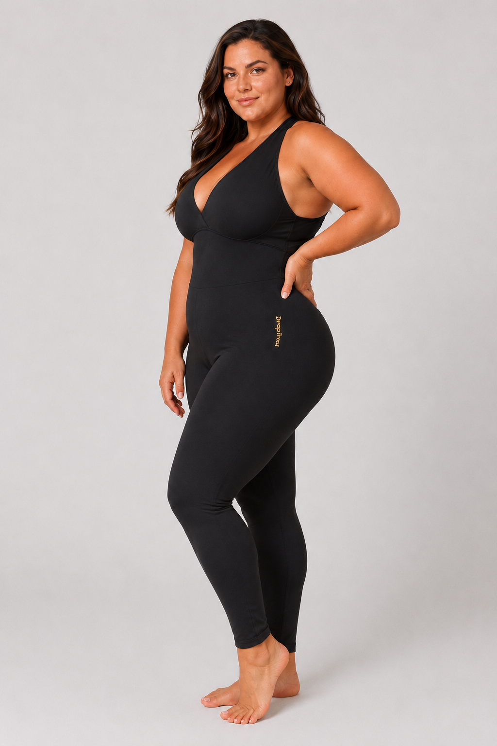 Woman wearing black DropTrou women's jumpsuit - extra large side studio view #Size_XL