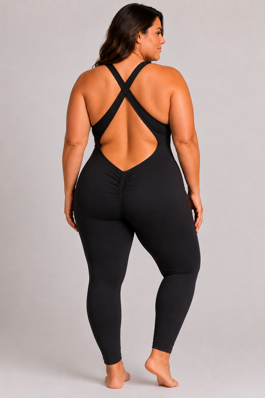 Woman wearing black DropTrou women's jumpsuit - extra large back studio view #Size_XL