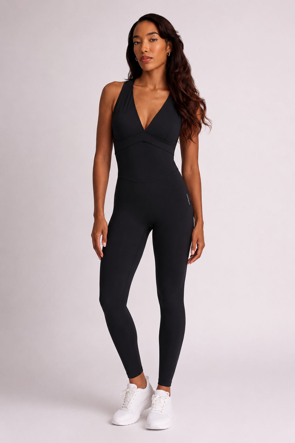 Woman wearing black DropTrou women's jumpsuit - extra small front studio view #Size_XS