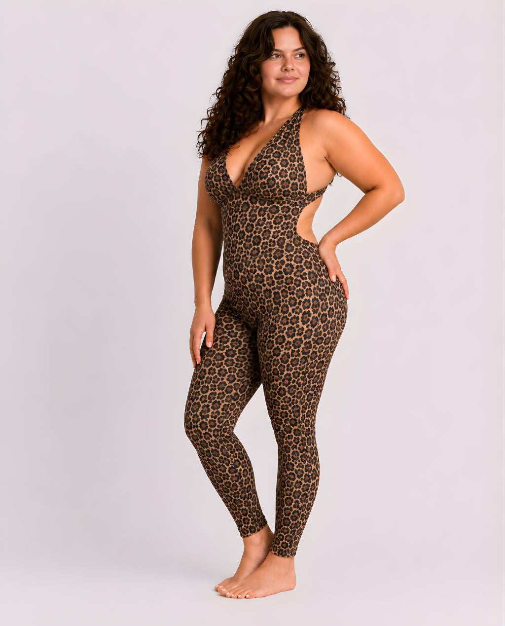 Woman wearing leopard DropTrou women's jumpsuit - large side studio view #Size_L