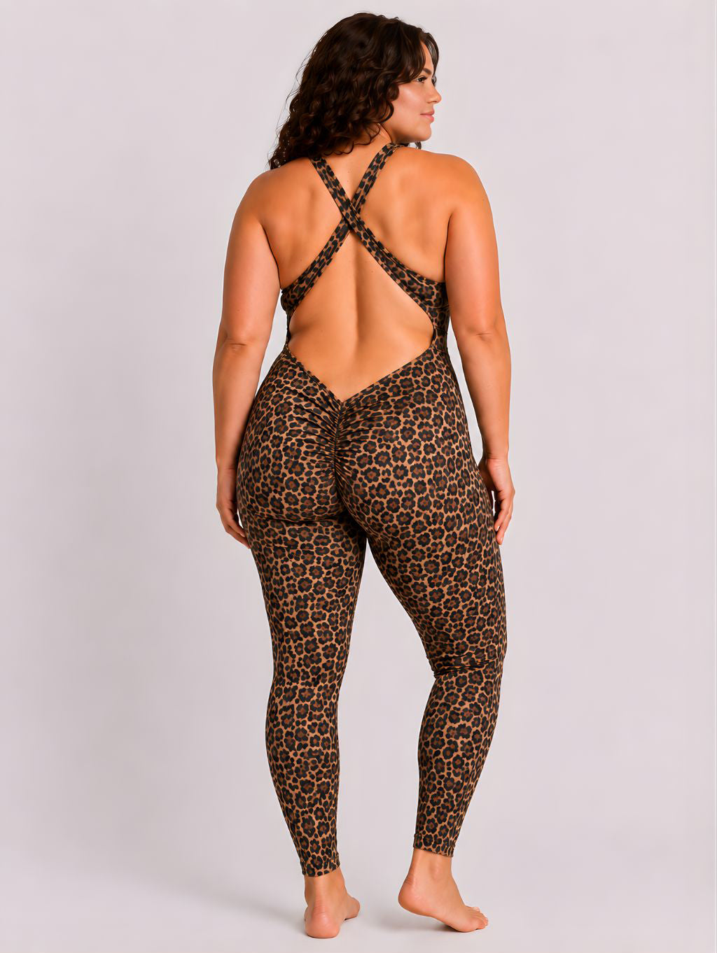 Woman wearing leopard DropTrou women's jumpsuit - large back studio view #Size_L