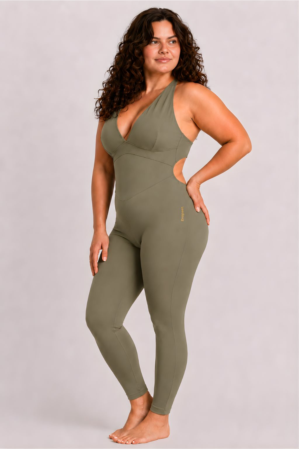 Woman wearing olive DropTrou women's jumpsuit - large side studio view #Size_L