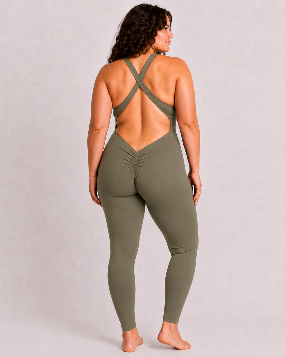 Woman wearing olive DropTrou women's jumpsuit - large back studio view #Size_L