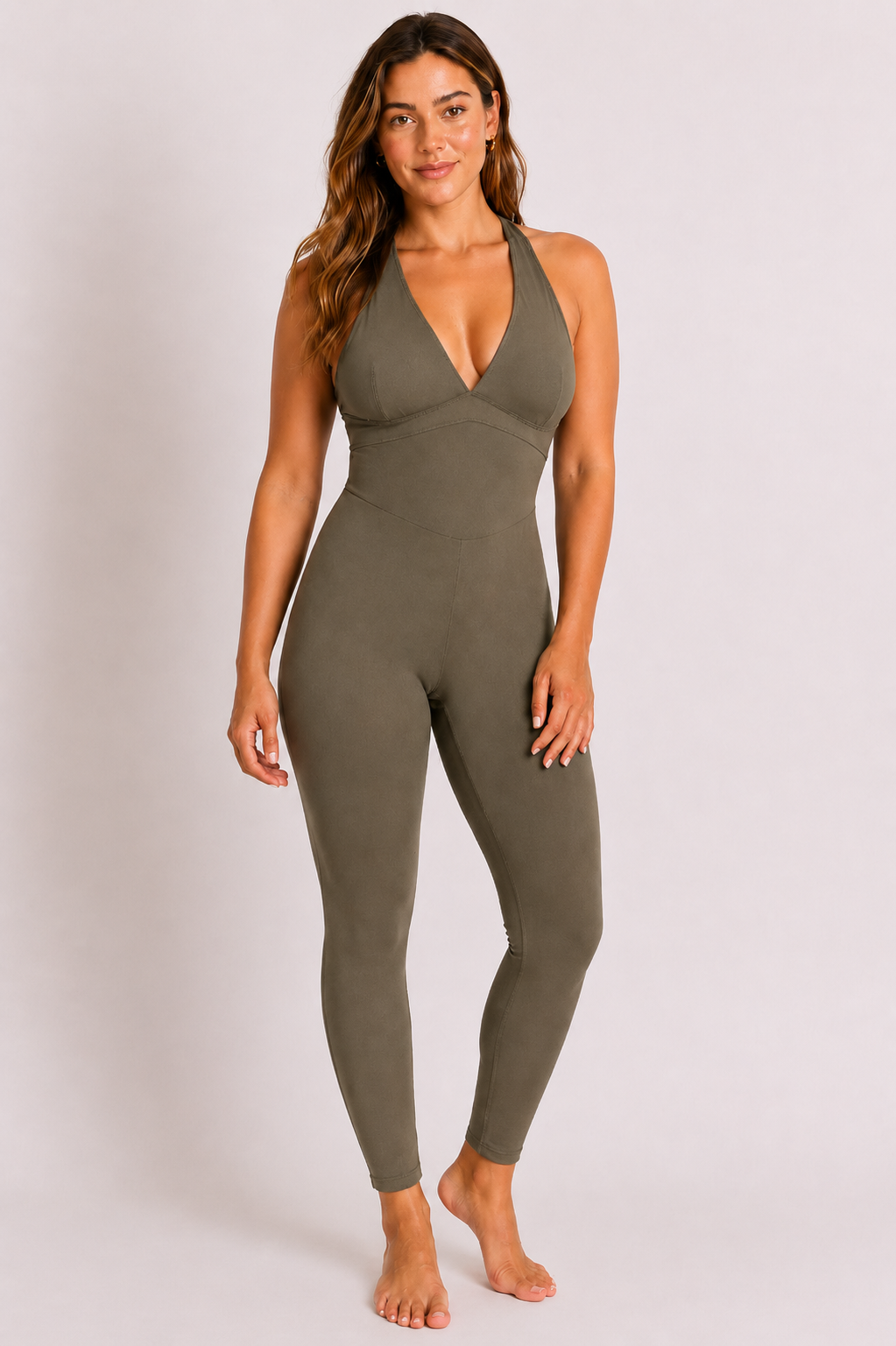 Woman wearing olive DropTrou women's jumpsuit - medium front studio view #Size_M