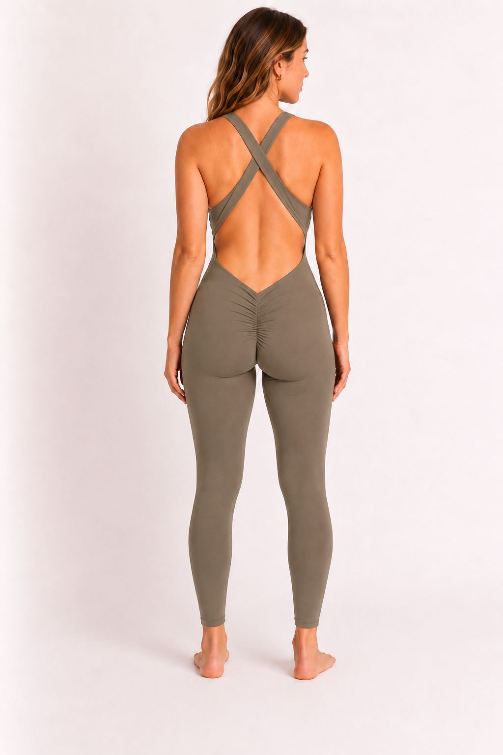 Woman wearing olive DropTrou women's jumpsuit - medium back studio view #Size_M
