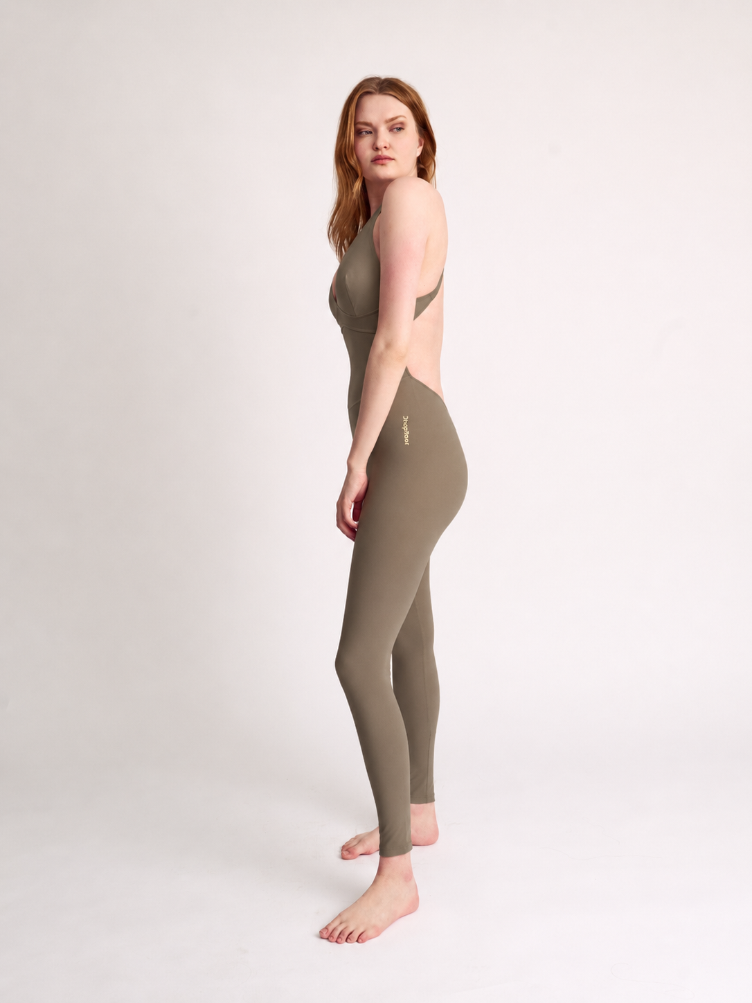 Woman wearing olive DropTrou women's jumpsuit - small side studio view #Size_S