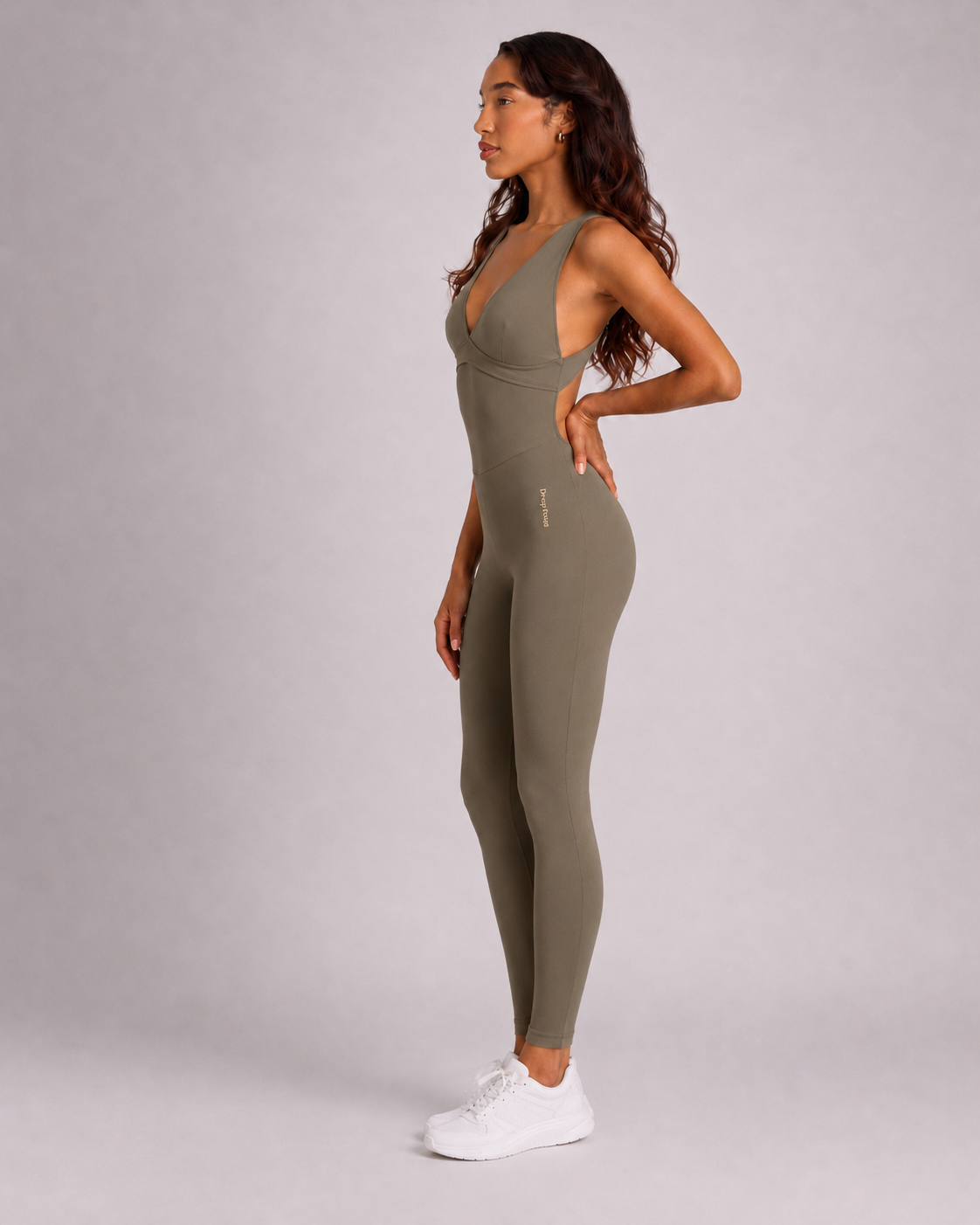 Woman wearing olive DropTrou women's jumpsuit - extra small side studio view #Size_XS