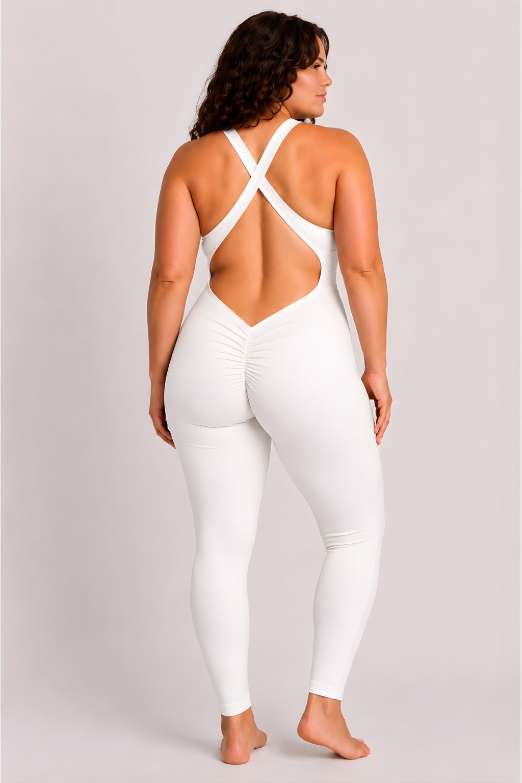 Woman wearing white DropTrou women's jumpsuit - large back studio view #Size_L