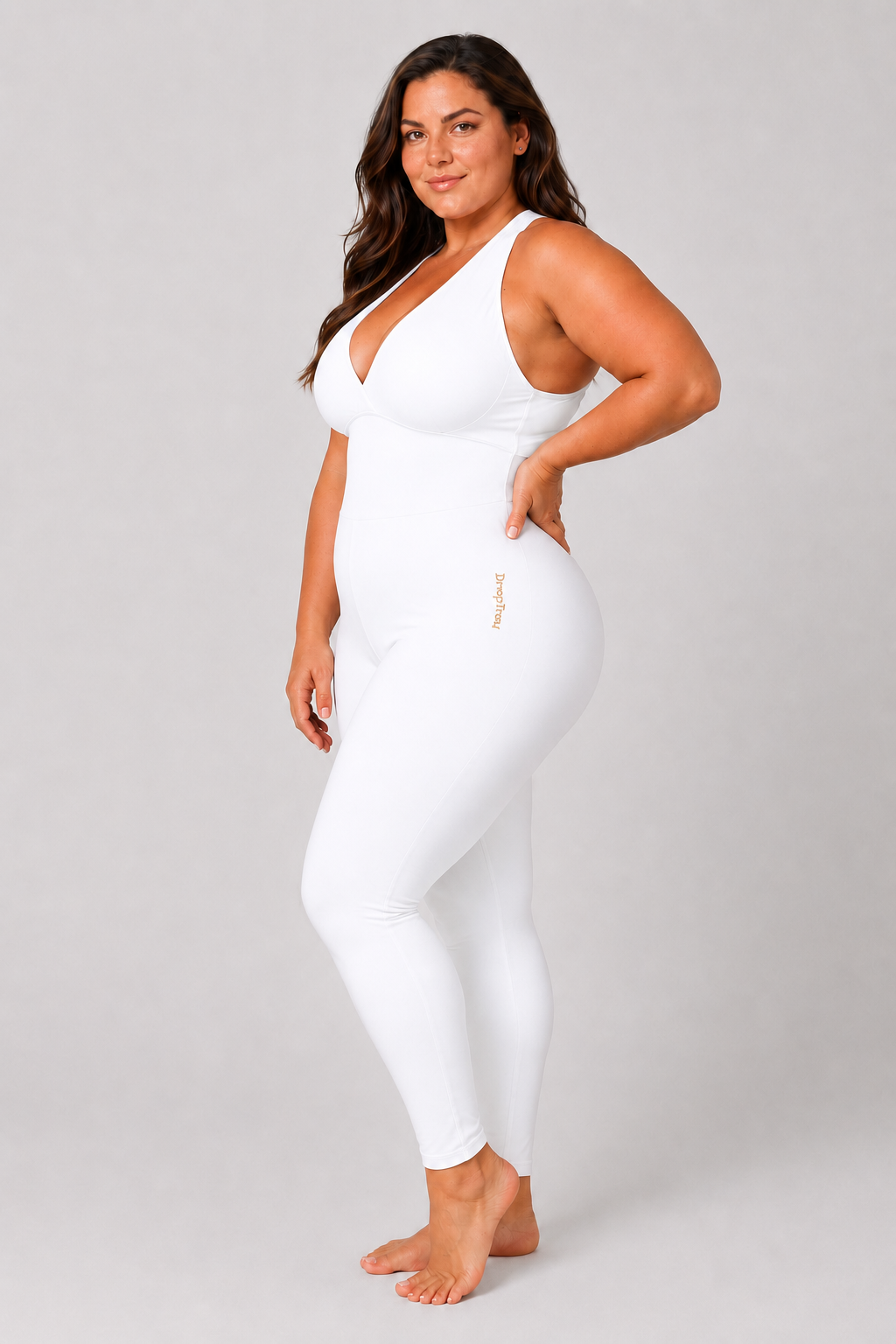 Woman wearing white DropTrou women's jumpsuit - extra large side studio view #Size_XL