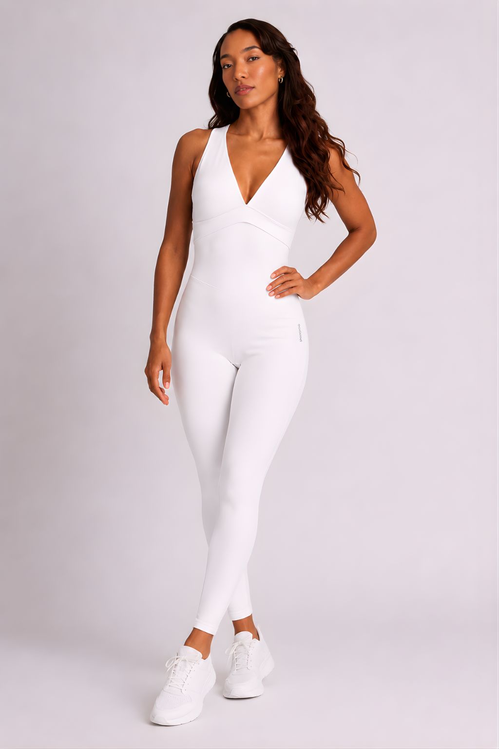 Woman wearing white DropTrou women's jumpsuit - extra small front studio view #Size_XS